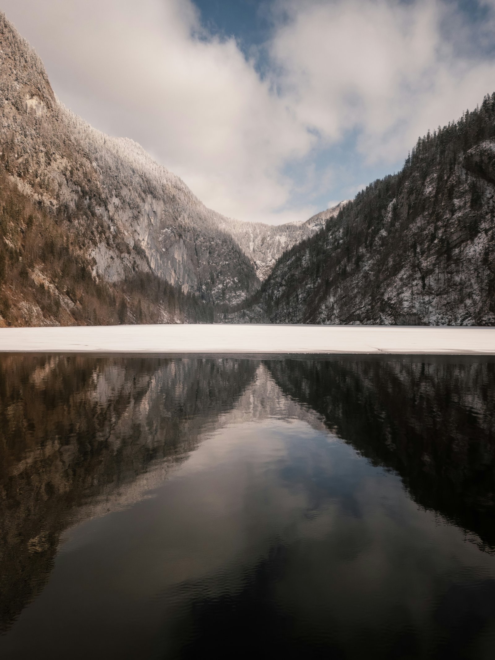 Pyrenees mountain peaks reflected perfectly in a still alpine lake