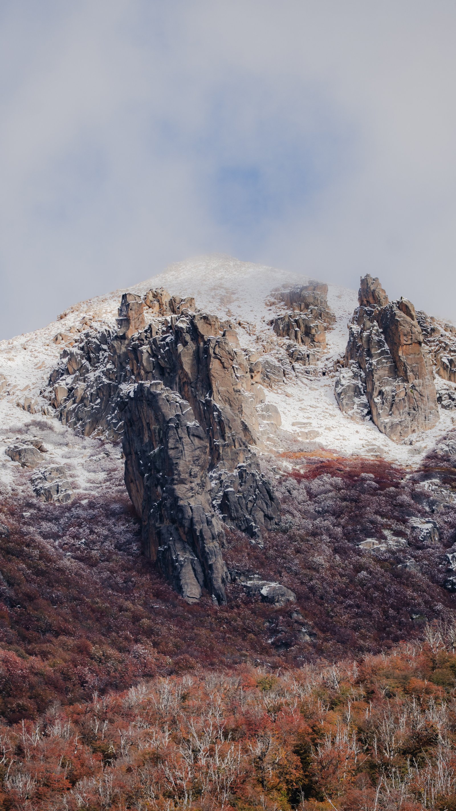 The approach slope above Villa Catedral. Snow on the upper faces, the trail still clear.