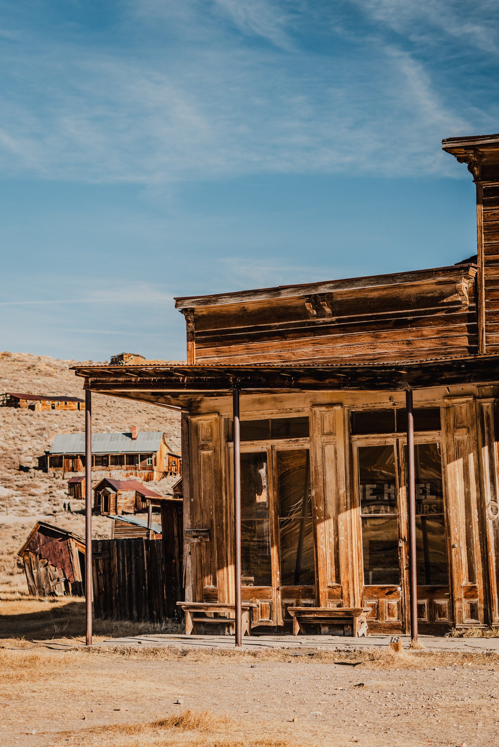View through a broken window into a Bodie home. Interior left as found.
