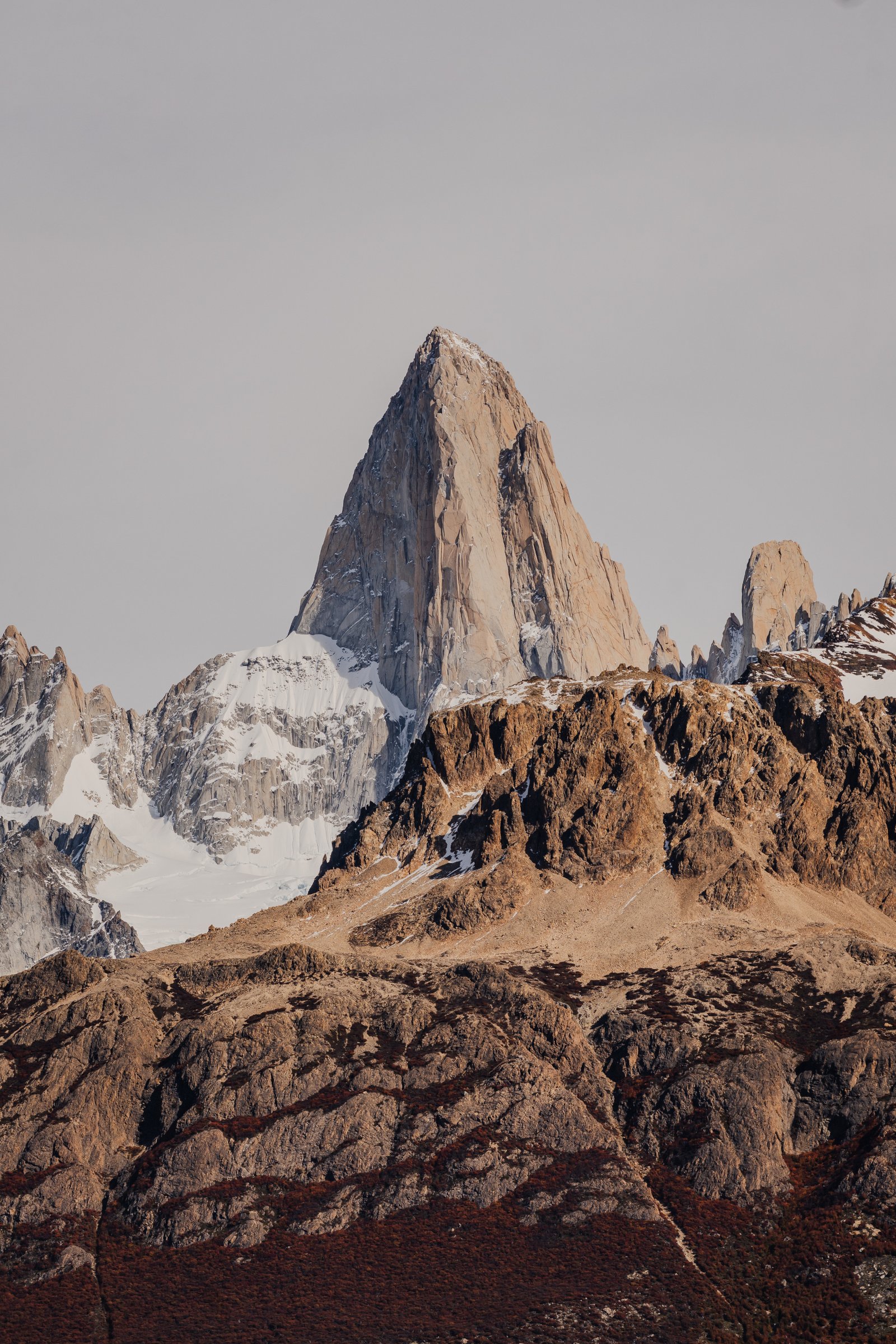 The moraine above the treeline. Red rock and snow-dusted peaks.