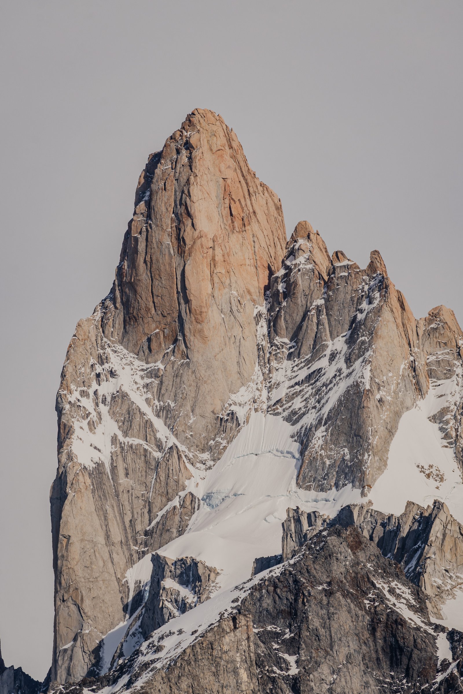 The summit pyramid and its satellites. Snow lodged in every crevice.