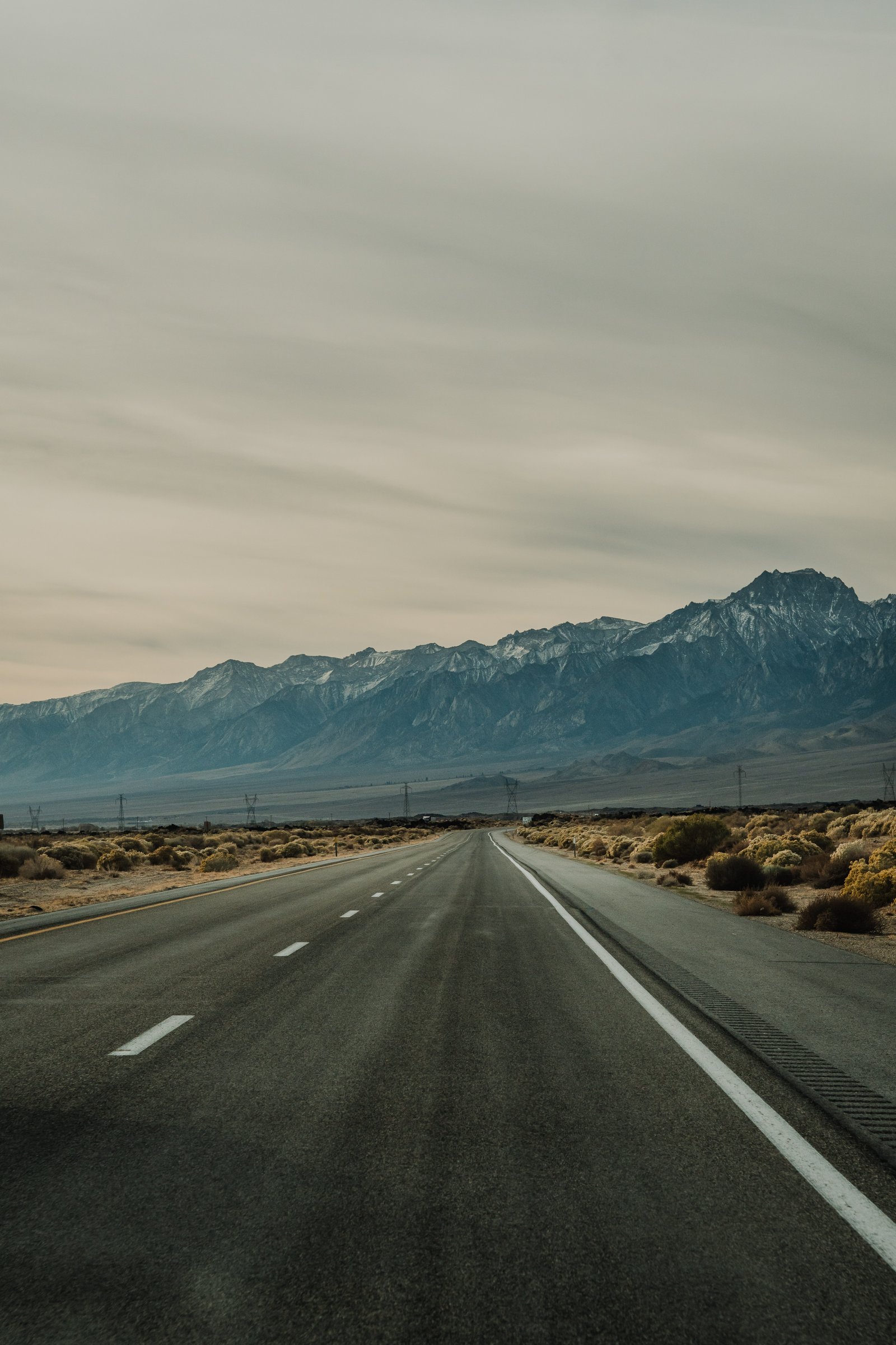 Overcast. The bare rock of the mountains on both sides with nothing growing on them.
