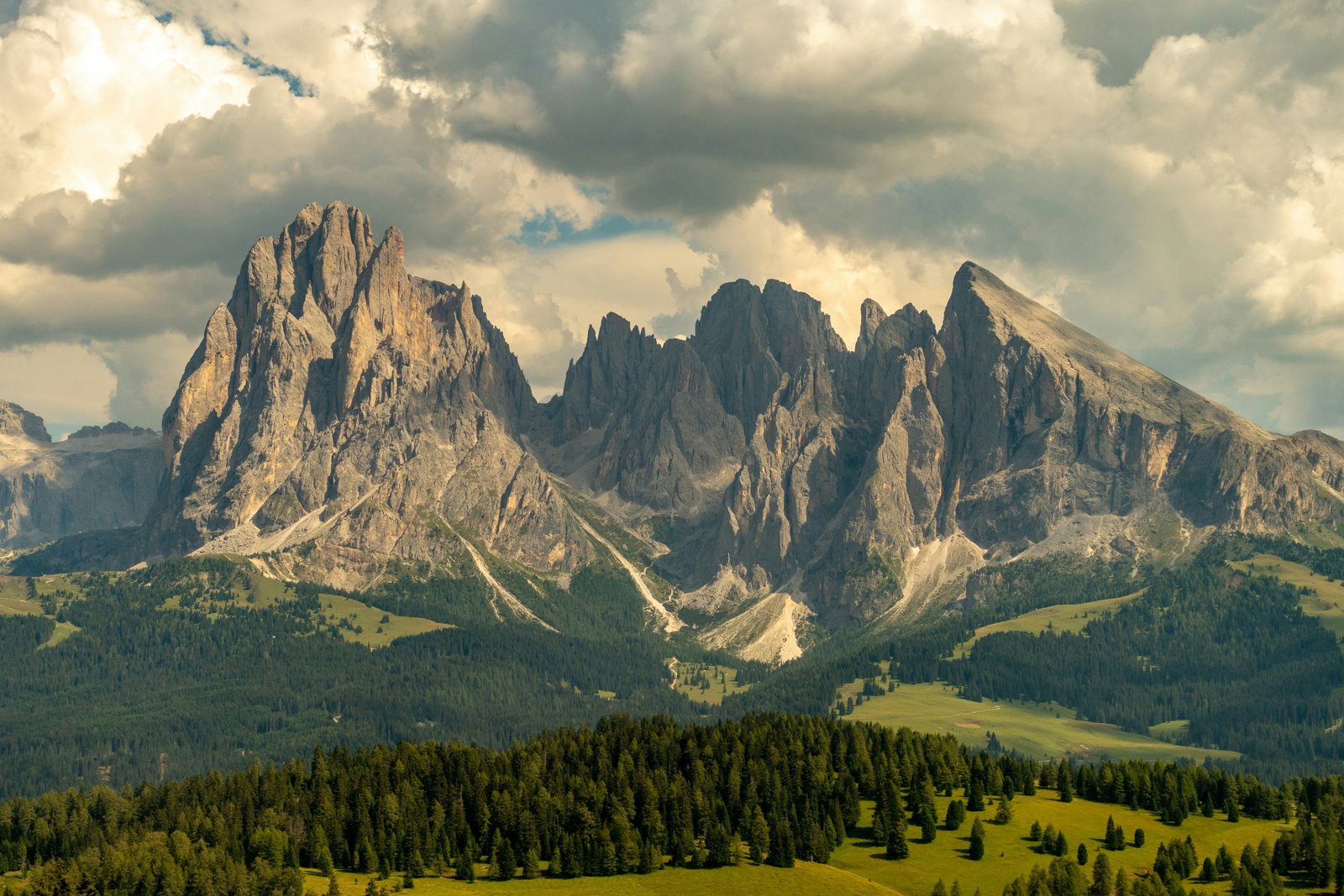 Tre Cime di Lavaredo north face at sunrise turning orange-gold