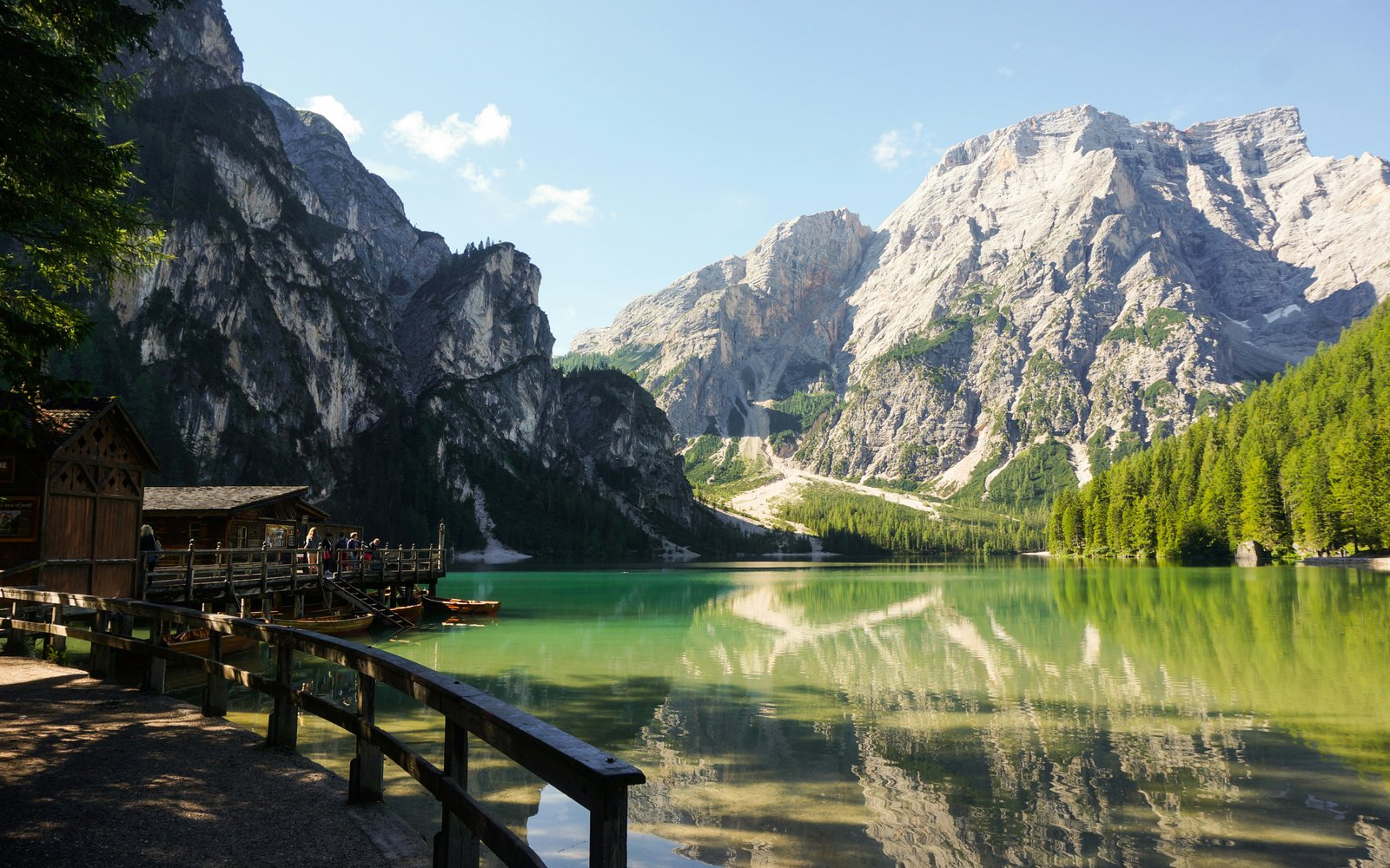 Lago di Braies with wooden boathouse and emerald water, South Tyrol