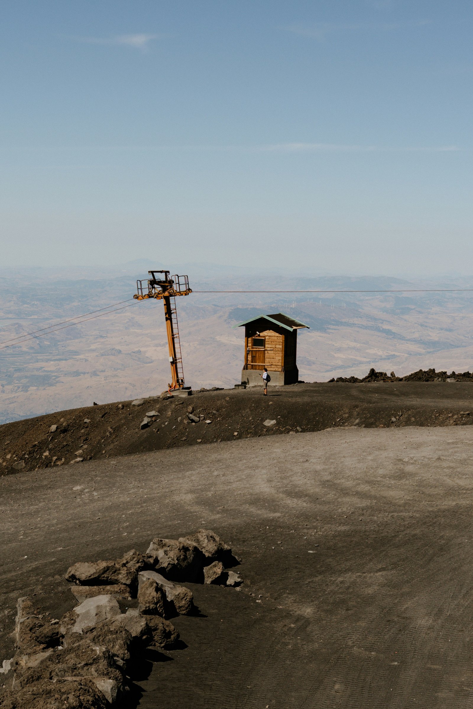 Summit approach on volcanic ash slope with the Southeast Crater smoking above hikers