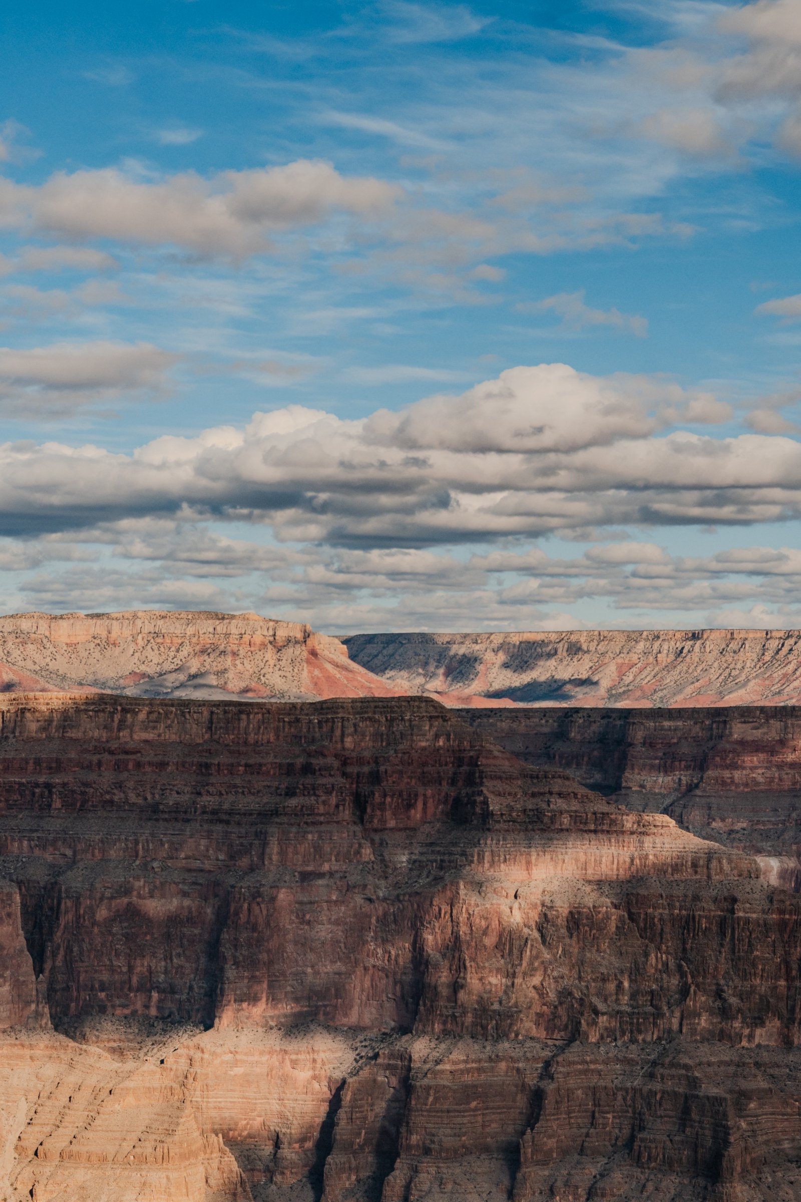 Late afternoon light across the canyon. The horizontal strata exposed by 1.8 billion years of erosion.