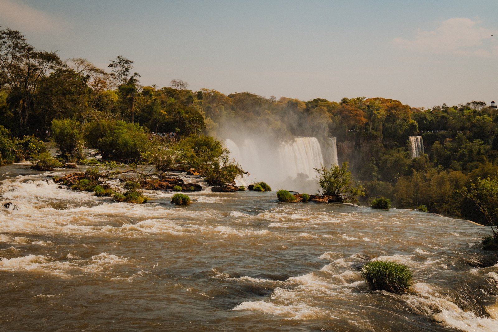 From the cliff edge above the lower falls. The river bends away into the gorge below.