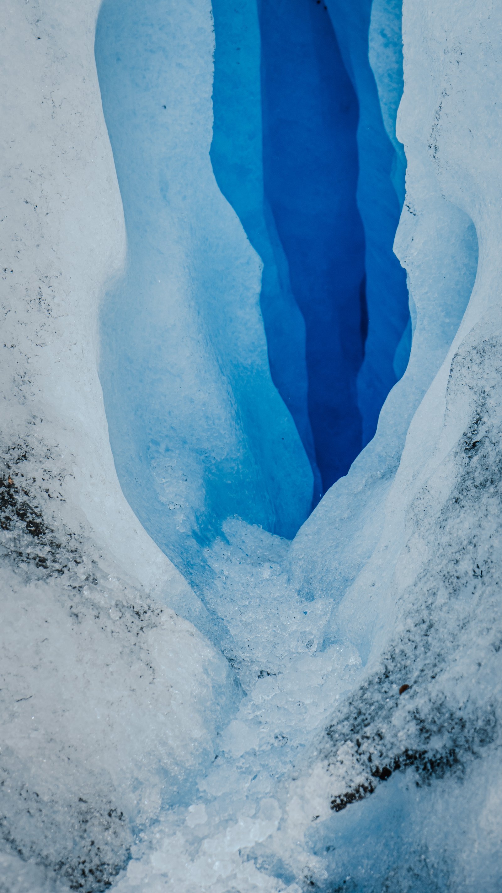 Narrow meltwater channel. Electric blue ice walls on either side.
