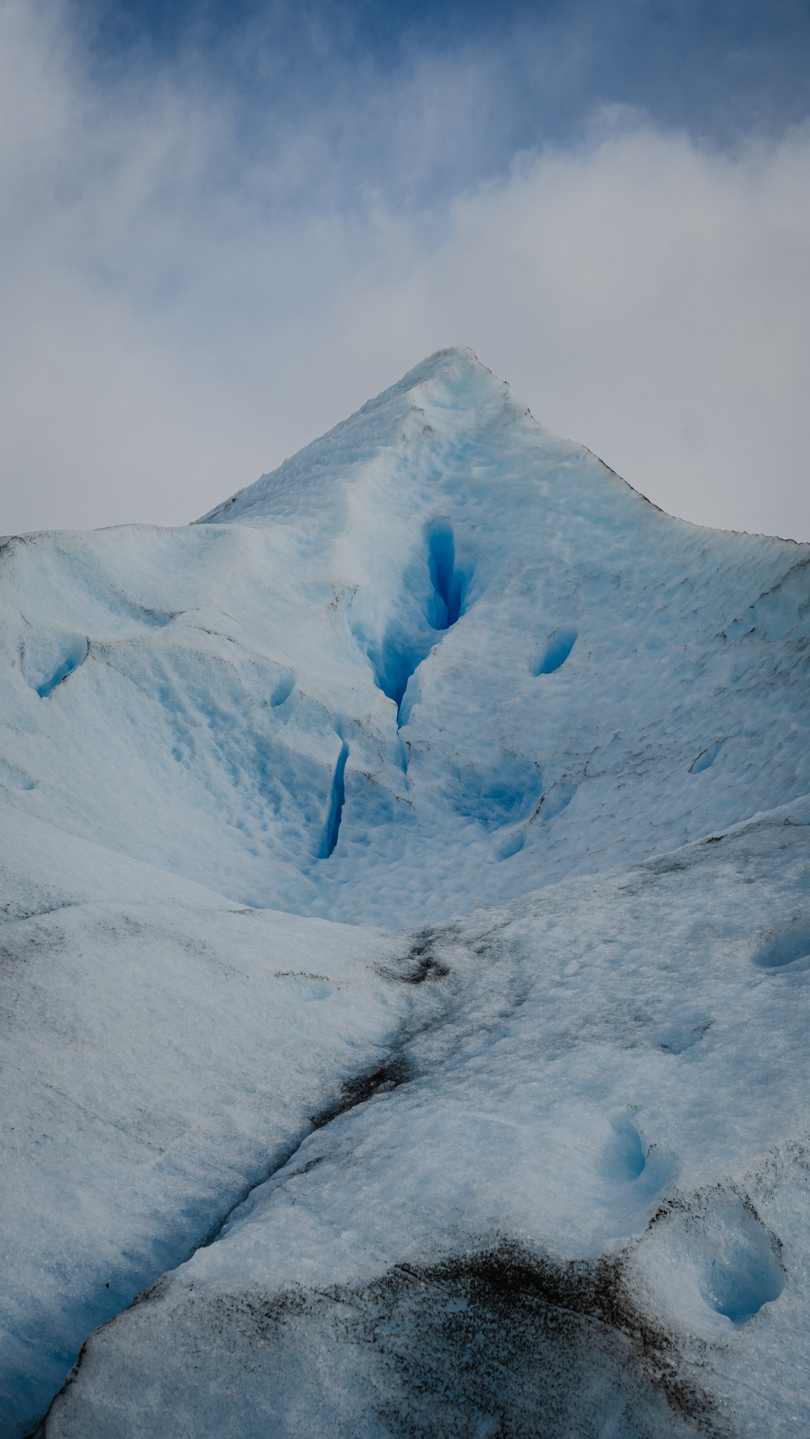 Two ice ridges framing a shadow valley between them.