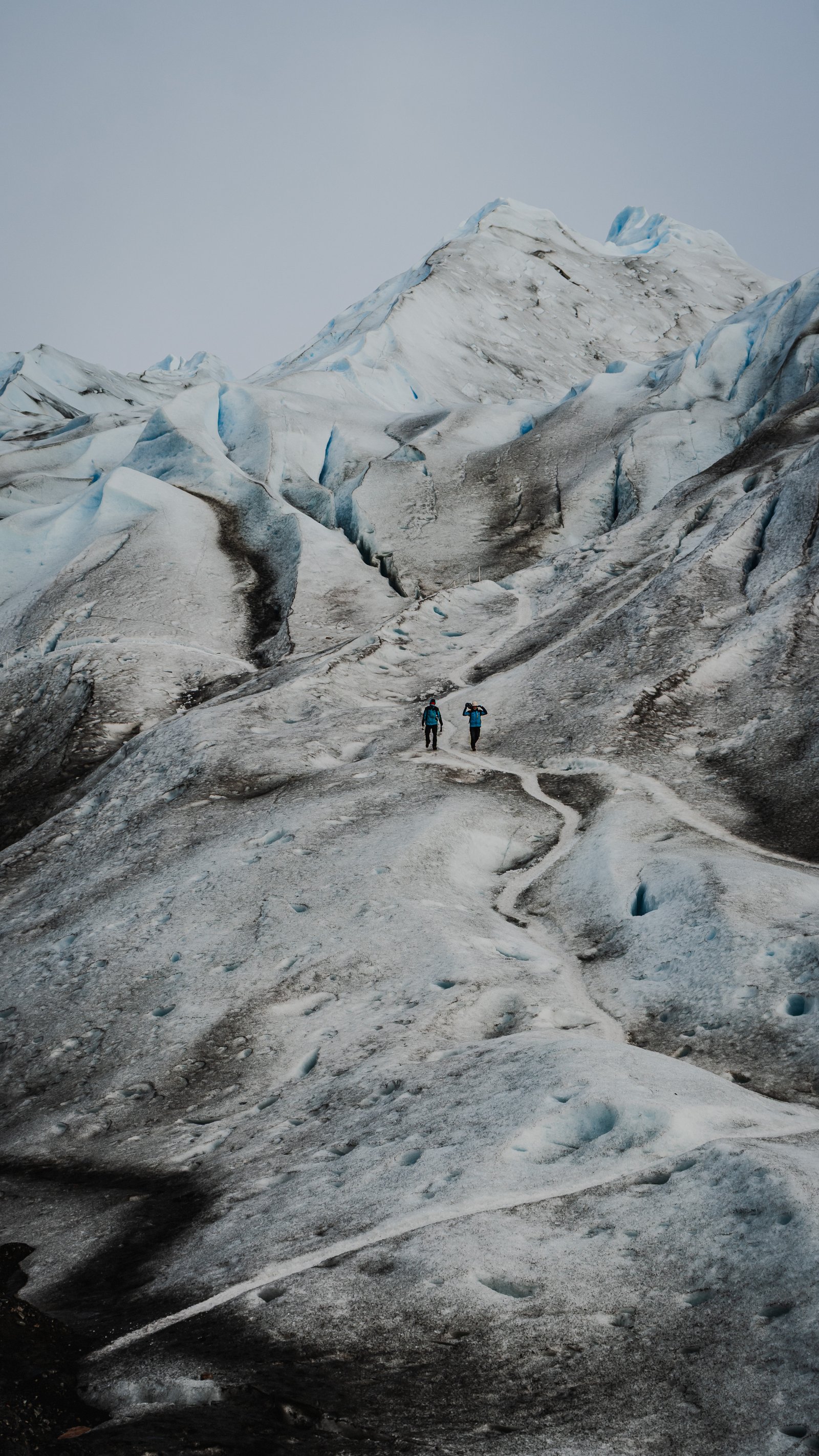 Ice hummocks and the figures below them. Scale made visible.