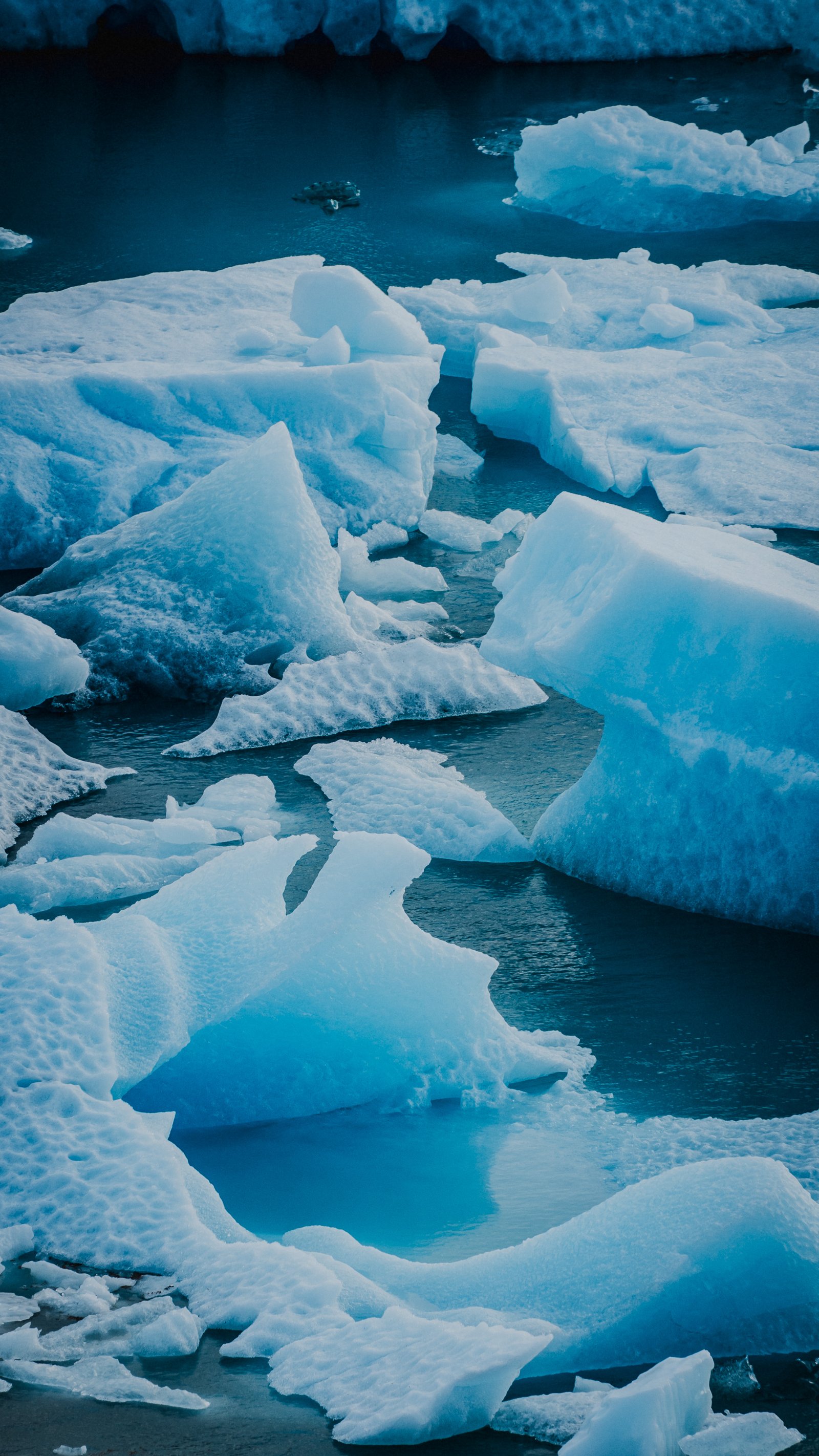 Calved ice chunks from above, dense and packed.