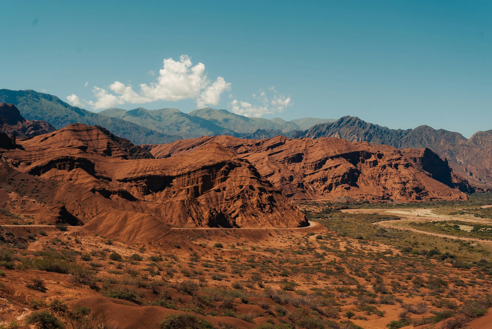 Quebrada de las Conchas red canyon walls and winding road through the valley