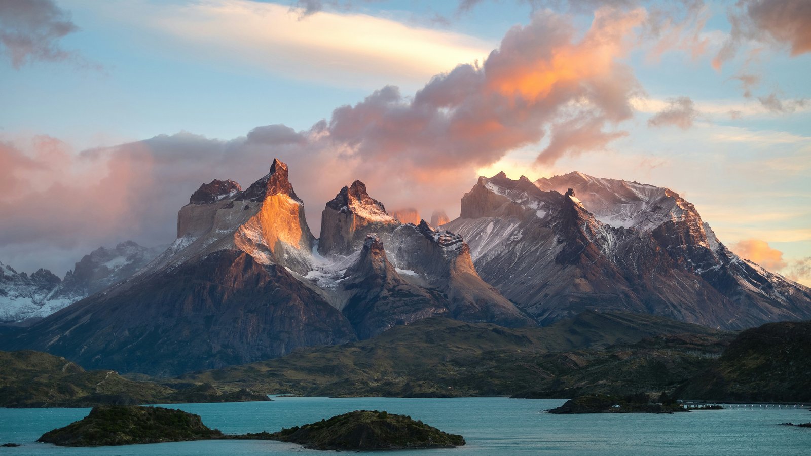Cuernos del Paine at golden hour sunset, warm light on the horns above Lago Peho&eacute;